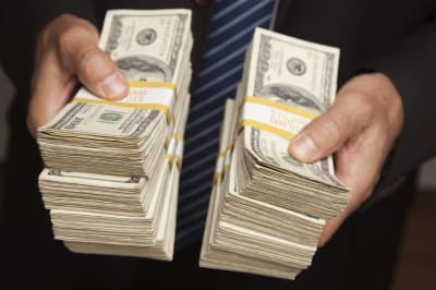 dollars in hands